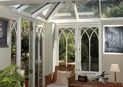 Conservatory with gothic arch style windows in Cotswolds